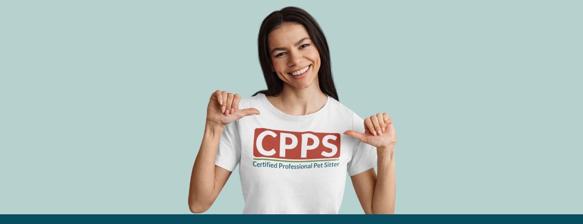 Female pet sitter wearing a white t-shirt with the Certified Professional Pet Sitter logo Certification for Pet Sitters